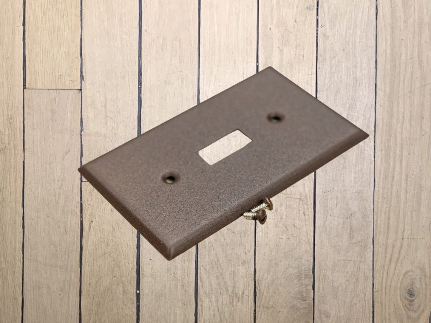 Walnut Texture powder coated Toggle, Rocker, Duplex, and Blank standard size metal switch plates.  Dark brown outlet cover