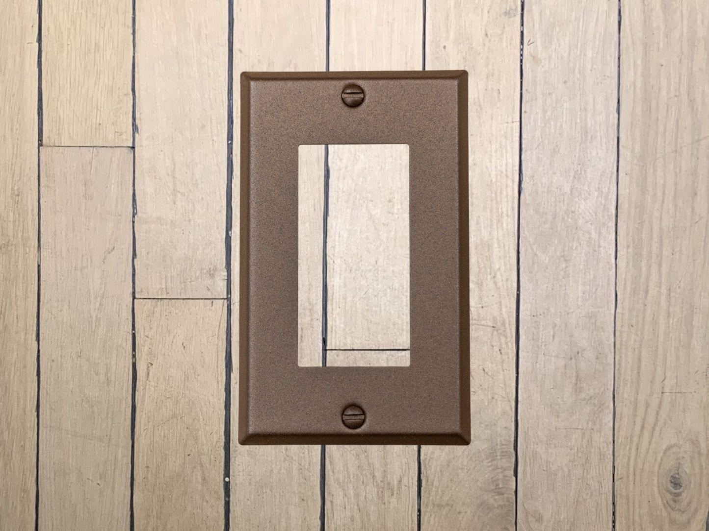 Walnut Texture powder coated Toggle, Rocker, Duplex, and Blank standard size metal switch plates.  Dark brown outlet cover