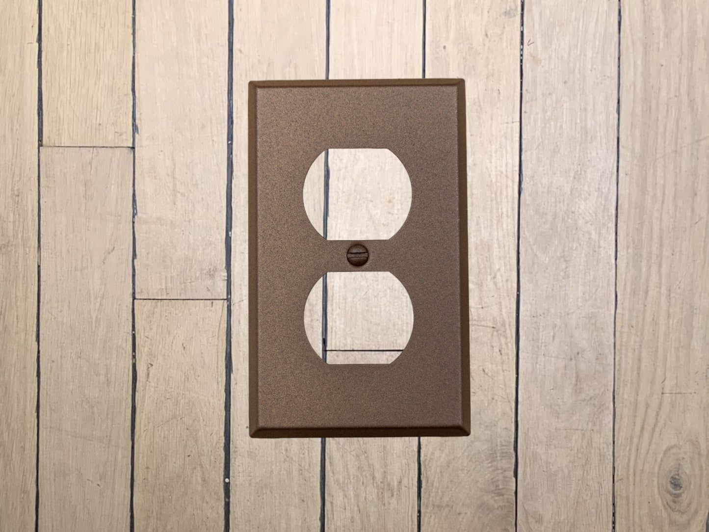 Walnut Texture powder coated Toggle, Rocker, Duplex, and Blank standard size metal switch plates.  Dark brown outlet cover