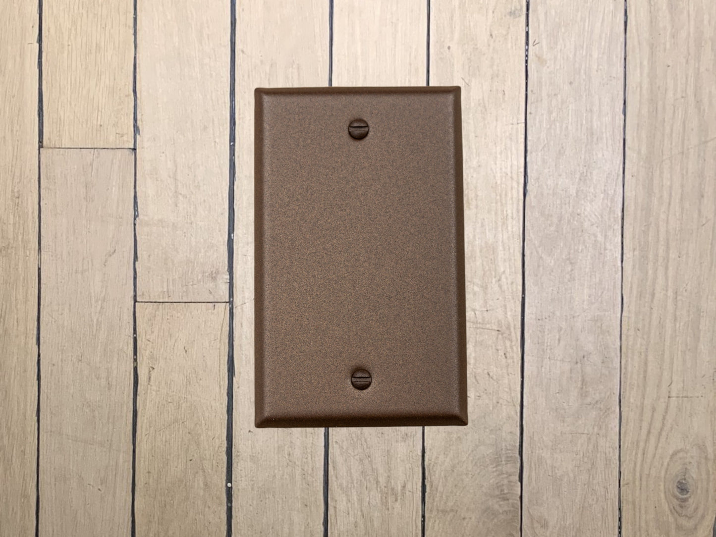 Walnut Texture powder coated Toggle, Rocker, Duplex, and Blank standard size metal switch plates.  Dark brown outlet cover