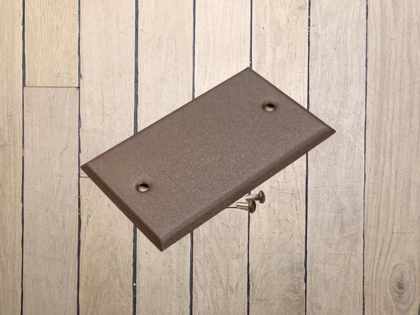 Walnut Texture powder coated Toggle, Rocker, Duplex, and Blank standard size metal switch plates.  Dark brown outlet cover