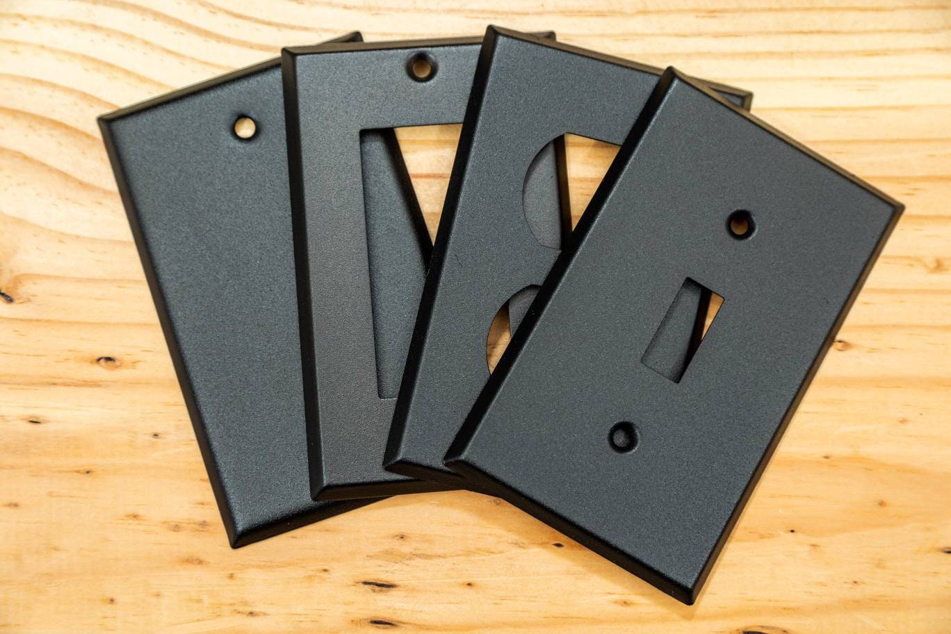 Rustic Black Cast powder coated Toggle, Rocker, Duplex, and Blank standard size metal switch plates.